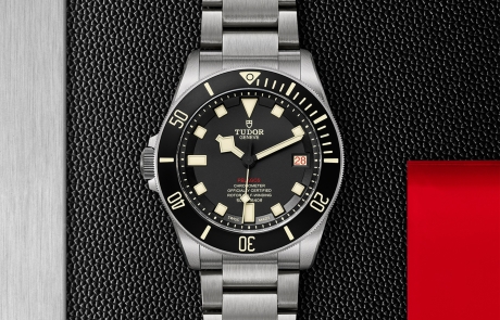 TUDOR PELAGOS displayed in a flat lay view emphasizing its design and craftsmanship.