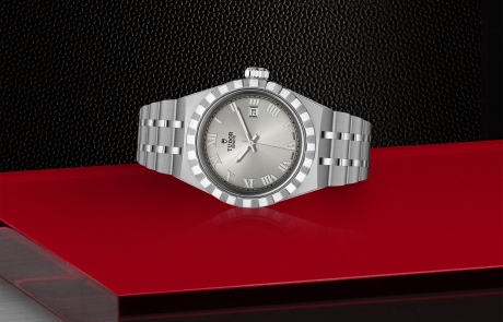 TUDOR TUDOR ROYAL laid down showcasing the silver, sunray-finish dial and overall elegance.