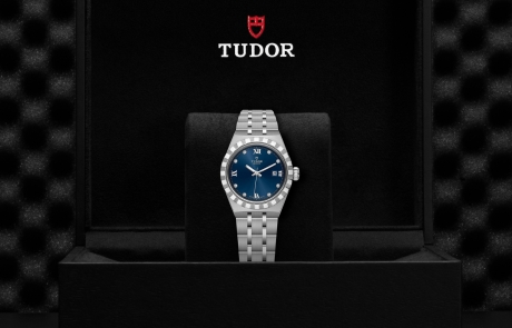 TUDOR TUDOR ROYAL nestled in its presentation box, symbolizing the watch's premium status.
