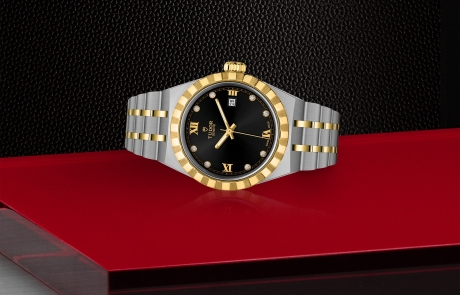 TUDOR TUDOR ROYAL laid down showcasing the black, sunray-finish, with diamonds dial and overall elegance.