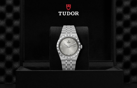TUDOR TUDOR ROYAL nestled in its presentation box, symbolizing the watch's premium status.