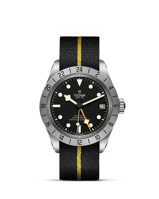 TUDOR BLACK BAY PRO presented upright against a white grid, focusing on its refined aesthetics.