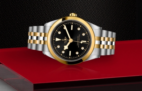 TUDOR BLACK BAY 31/36/39/41 laid down showcasing the black with diamond hour markers dial and overall elegance.