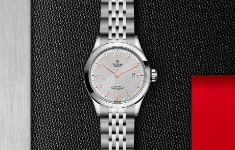 TUDOR 1926 displayed in a flat lay view emphasizing its design and craftsmanship.
