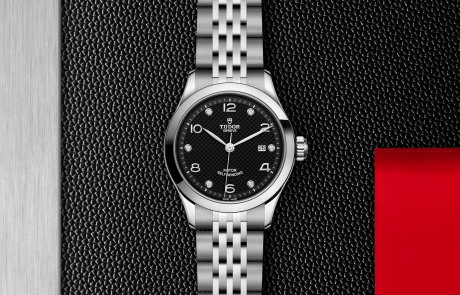 TUDOR 1926 displayed in a flat lay view emphasizing its design and craftsmanship.