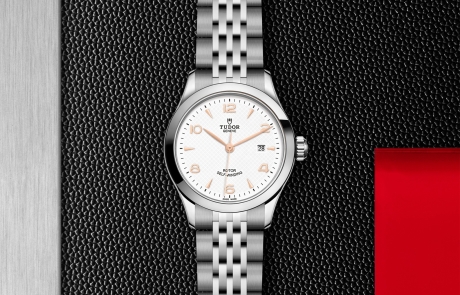TUDOR 1926 displayed in a flat lay view emphasizing its design and craftsmanship.
