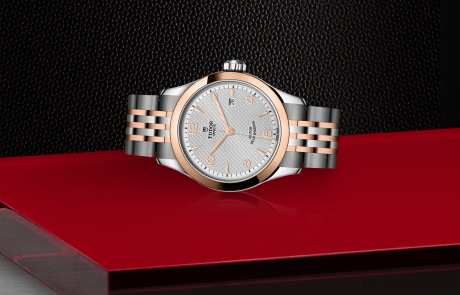 TUDOR 1926 laid down showcasing the silver, embossed decoration, domed dial and overall elegance.