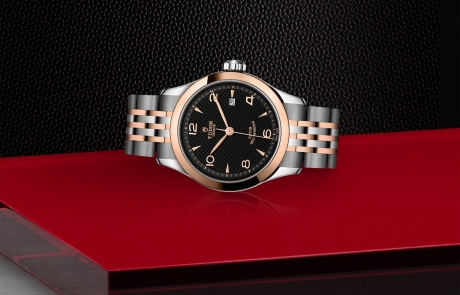 TUDOR 1926 laid down showcasing the black, embossed decoration, domed dial and overall elegance.