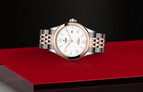 TUDOR 1926 laid down showcasing the white, embossed decoration, domed dial and overall elegance.