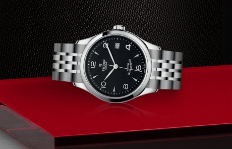 TUDOR 1926 laid down showcasing the black, embossed decoration, domed dial and overall elegance.