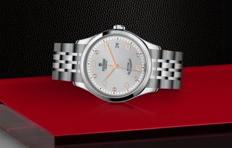 TUDOR 1926 laid down showcasing the silver, embossed decoration, domed, with 5 diamonds dial and overall elegance.