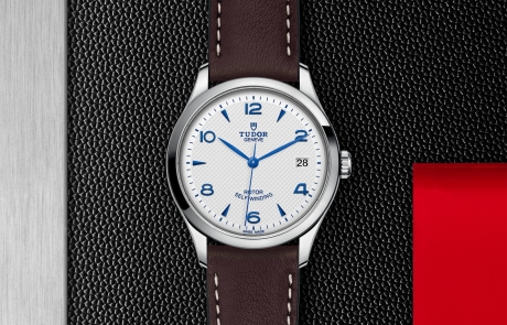 TUDOR 1926 displayed in a flat lay view emphasizing its design and craftsmanship.