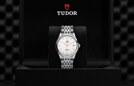TUDOR 1926 nestled in its presentation box, symbolizing the watch's premium status.