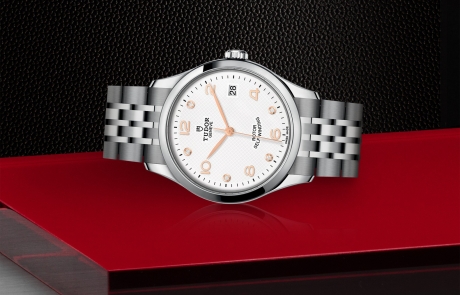 TUDOR 1926 laid down showcasing the white, embossed decoration, domed, with 5 diamonds dial and overall elegance.