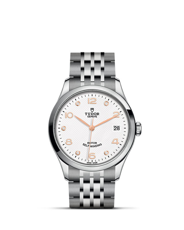 TUDOR 1926 presented upright against a white grid, focusing on its refined aesthetics.