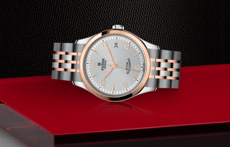 TUDOR 1926 laid down showcasing the silver, embossed decoration, domed dial and overall elegance.