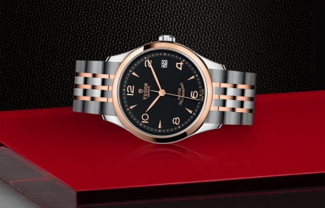 TUDOR 1926 laid down showcasing the black, embossed decoration, domed dial and overall elegance.