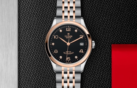 TUDOR 1926 displayed in a flat lay view emphasizing its design and craftsmanship.