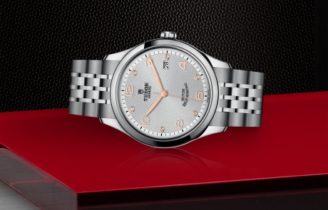 TUDOR 1926 laid down showcasing the silver, embossed decoration, domed, with 6 diamonds dial and overall elegance.