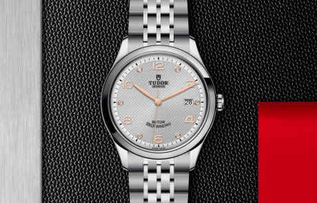 TUDOR 1926 displayed in a flat lay view emphasizing its design and craftsmanship.