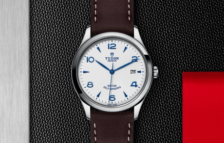 TUDOR 1926 displayed in a flat lay view emphasizing its design and craftsmanship.
