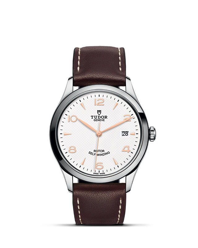 TUDOR 1926 presented upright against a white grid, focusing on its refined aesthetics.