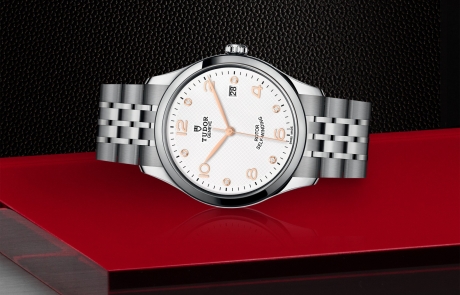 TUDOR 1926 laid down showcasing the white, embossed decoration, domed, with 6 diamonds dial and overall elegance.