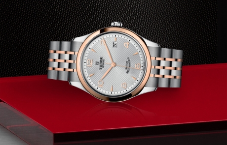 TUDOR 1926 laid down showcasing the silver, embossed decoration, domed dial and overall elegance.