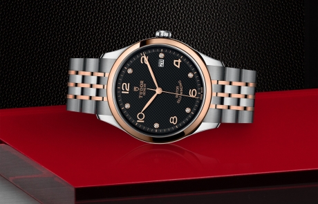 TUDOR 1926 laid down showcasing the black, embossed decoration, domed, with 6 diamonds dial and overall elegance.