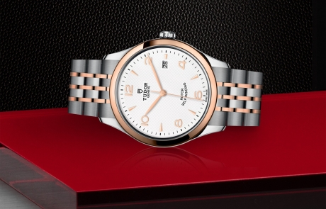 TUDOR 1926 laid down showcasing the white, embossed decoration, domed dial and overall elegance.