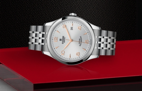 TUDOR 1926 laid down showcasing the silver, embossed decoration, domed dial and overall elegance.
