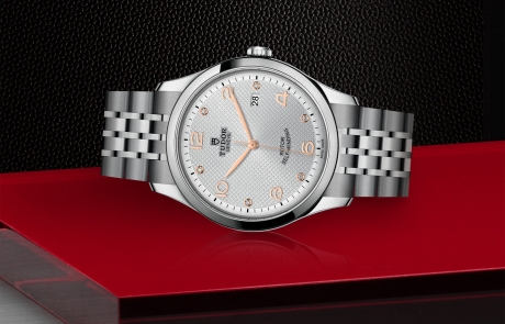 TUDOR 1926 laid down showcasing the silver, embossed decoration, domed, with 6 diamonds dial and overall elegance.