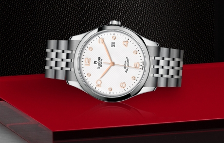 TUDOR 1926 laid down showcasing the white, embossed decoration, domed, with 6 diamonds dial and overall elegance.