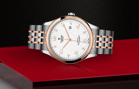 TUDOR 1926 laid down showcasing the white, embossed decoration, domed, with 6 diamonds dial and overall elegance.