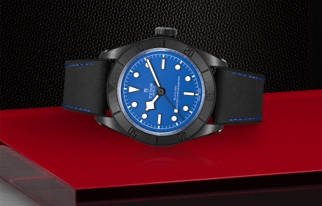 TUDOR BLACK BAY laid down showcasing the blue, domed dial and overall elegance.