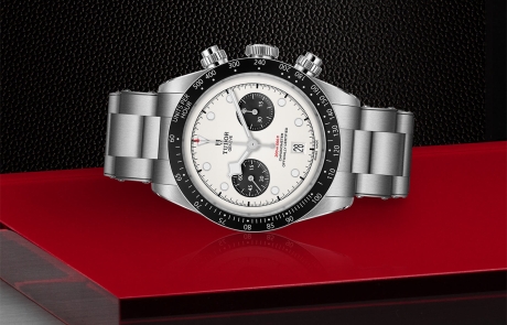 TUDOR BLACK BAY CHRONO laid down showcasing the opaline with black counters, domed dial and overall elegance.