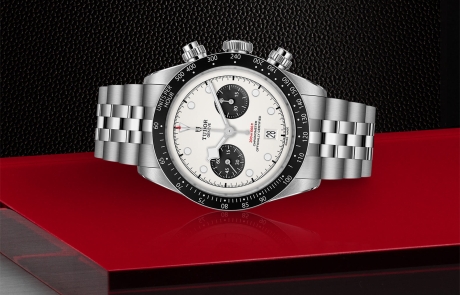 TUDOR BLACK BAY CHRONO laid down showcasing the opaline with black counters, domed dial and overall elegance.