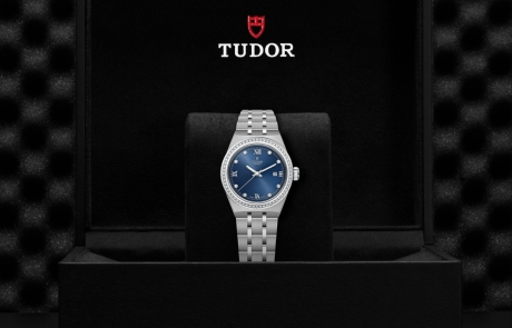 TUDOR TUDOR ROYAL nestled in its presentation box, symbolizing the watch's premium status.