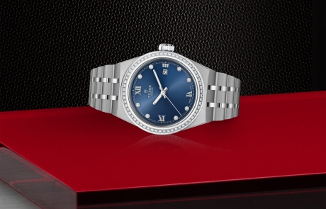 TUDOR TUDOR ROYAL laid down showcasing the blue, sunray-finish, with diamonds dial and overall elegance.