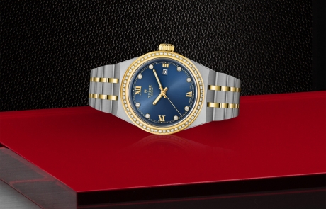 TUDOR TUDOR ROYAL laid down showcasing the blue dial and overall elegance.